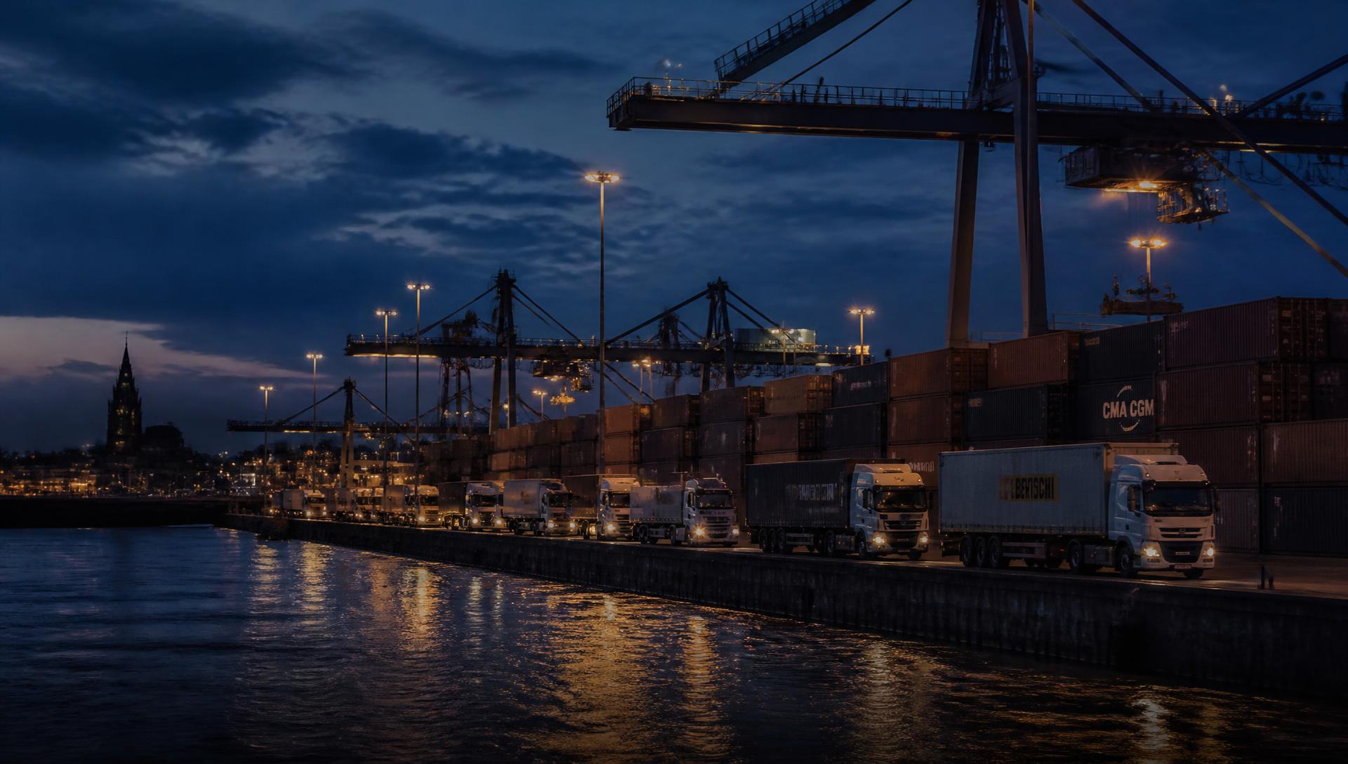 European port terminal at blue hour with containers, cranes and waiting trucks